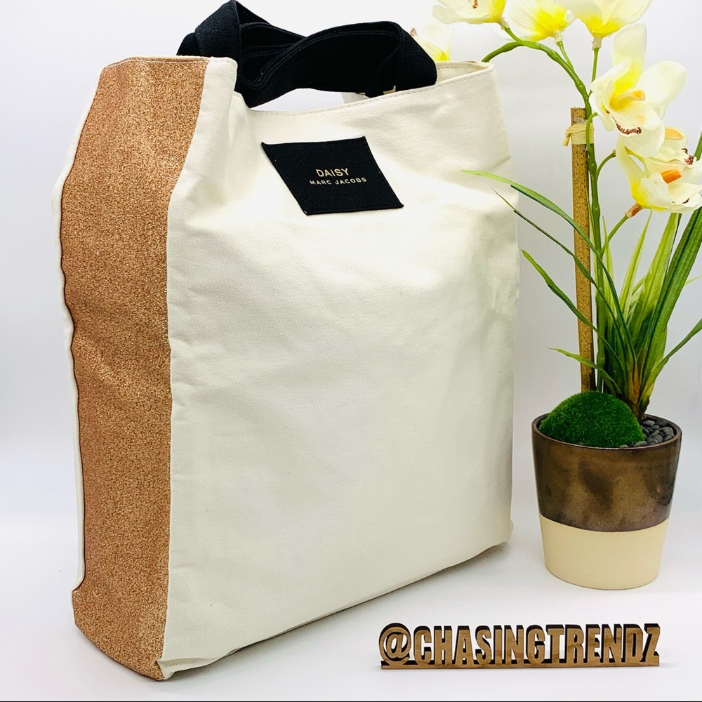 Marc Jacob’s Daisy Gold Canvas Multi Use Tote Bag